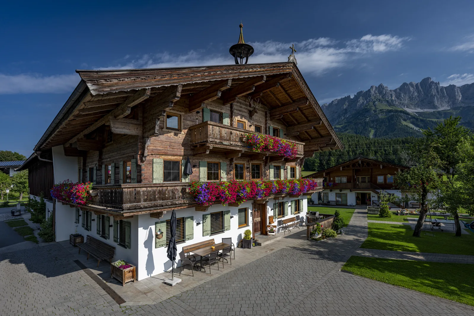 Historic Bauernhaus at the Gafalhof against the backdrop of the Wilder Kaiser