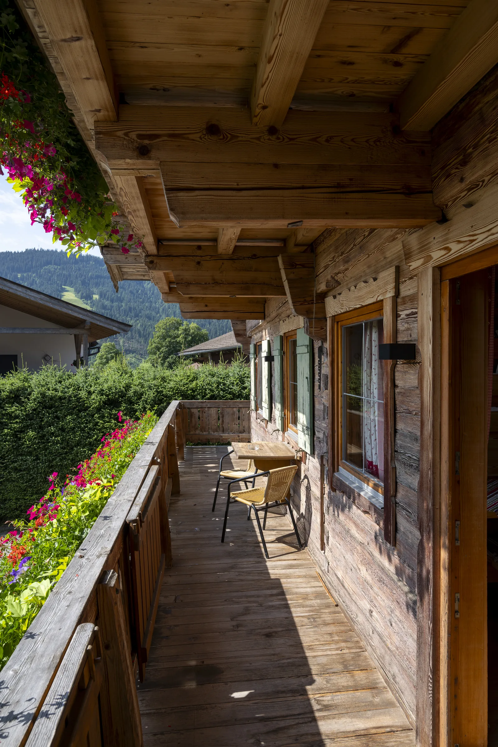 Covered balcony walkway on the Bauernhaus at the Gafalhof with flowers